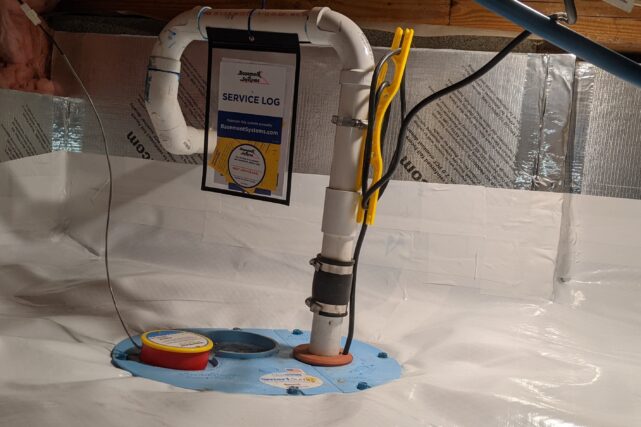 Sump pump installed in a basement to prevent water accumulation and protect foundation integrity