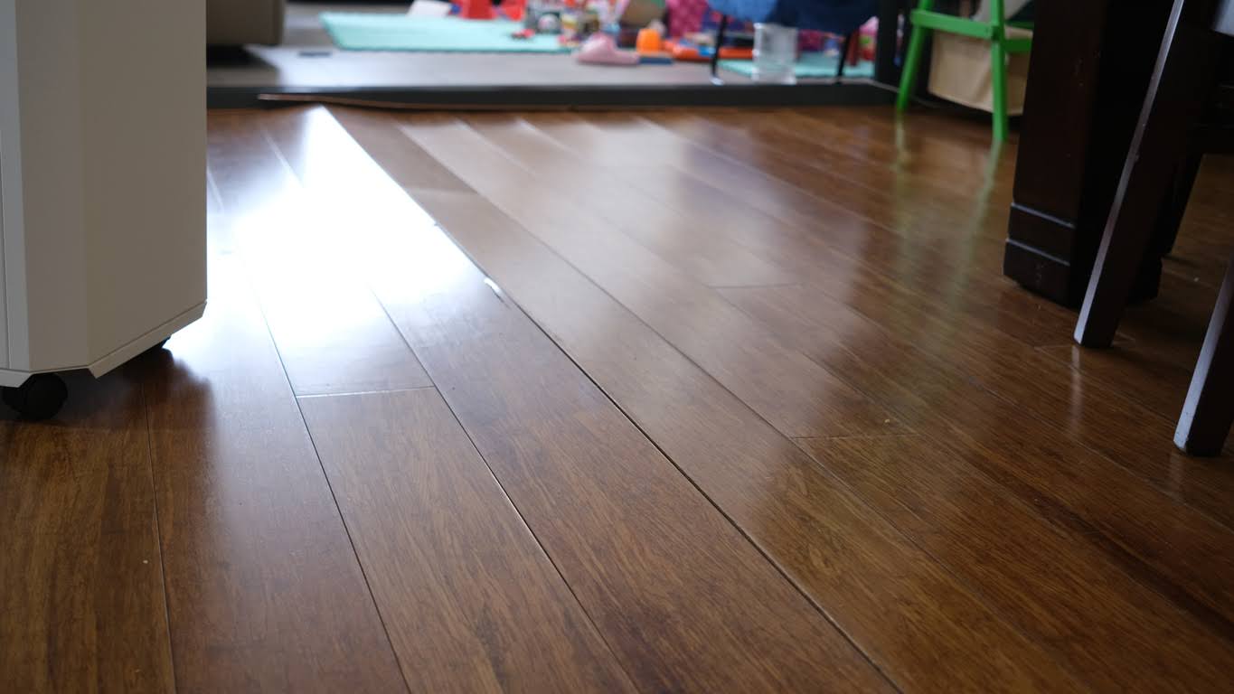 Corrugated Wooden Floor Due To Expansion At Living Room.
