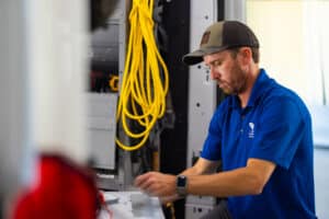 Service technician performing maintenance on unit